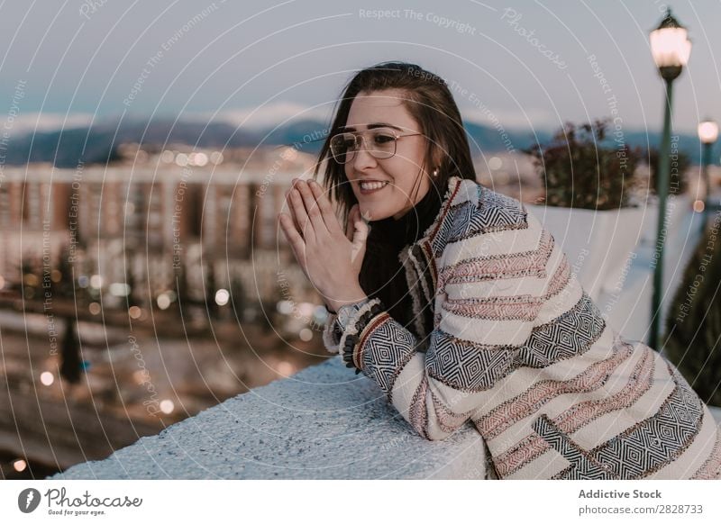 Cheerful young woman leaning on fence Woman pretty Youth (Young adults) Beautiful Fence Lean Town Street Smiling Person wearing glasses Brunette Attractive