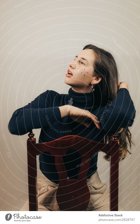 Smiling woman sitting on chair Woman pretty Youth (Young adults) Sit Beautiful Cheerful Chair glitters Face Brunette Attractive Human being Beauty Photography