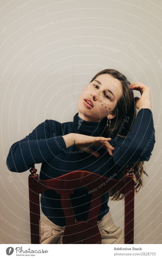 Smiling woman sitting on chair Woman pretty Youth (Young adults) Sit Beautiful Cheerful Chair glitters Face Brunette Attractive Human being Beauty Photography