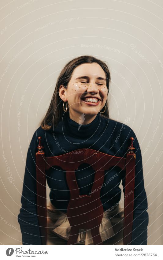 Smiling woman sitting on chair Woman pretty Youth (Young adults) Sit Beautiful Cheerful Chair glitters Face Brunette Attractive Human being Beauty Photography