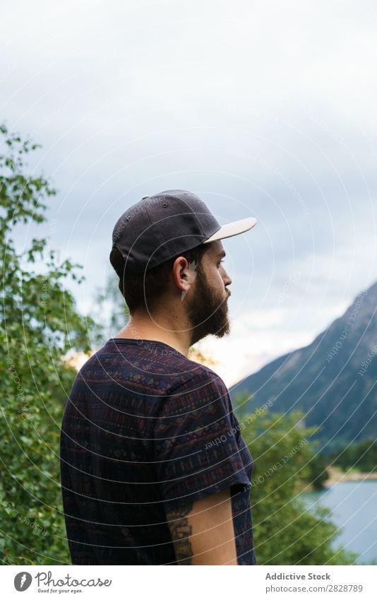 Man posing at lake Stone Lake Mountain Nature Landscape Excitement Looking away Water Rock Beautiful Youth (Young adults) Hiking Vacation & Travel Adventure