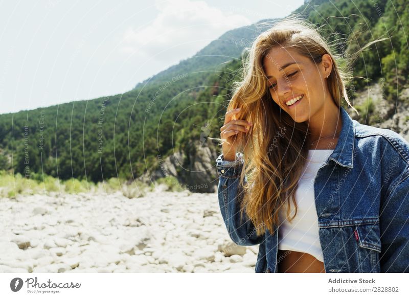 Happy girl posing on the stones of a river Woman Posture traveler trekking Tropical Mountain Rock Paradise Hiking enjoyment Tourism River Summer pose