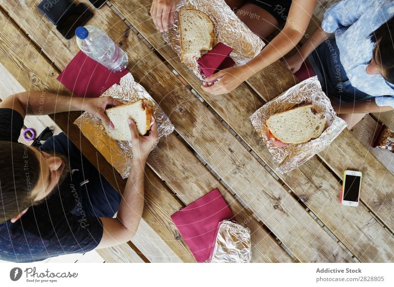 Crop friends having meal while traveling Human being Friendship Traveling Vacation & Travel Café Adventure Eating chatting Lunch Cheerful Summer Food Freedom