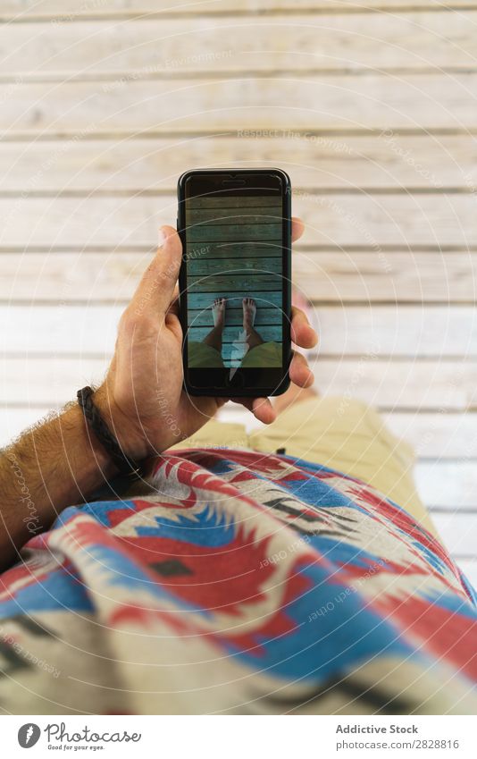 Man taking feet shots Feet Story Wood PDA Shot Screen device Gadget Stand Legs Barefoot beachwear Lifestyle Human being Plank Board Home Wear Rough Abstract