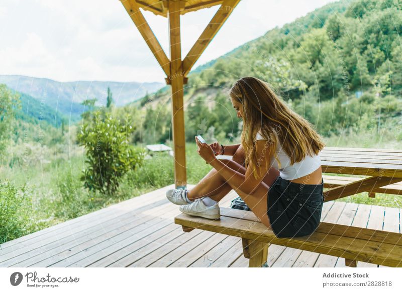 Woman using phone on terrace PDA Terrace Hill pretty browsing spectacular Point scenery Vacation & Travel Vantage point Youth (Young adults) Tourist Tourism