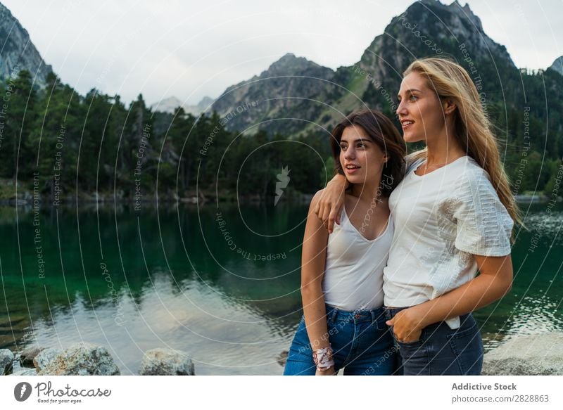 Women at lake in mountains Woman Mountain Walking Hiking Lake Water embracing Smiling Cheerful Happy Vacation & Travel Adventure Tourist Youth (Young adults)