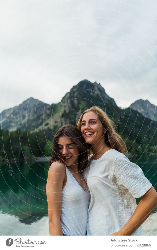 Women at lake in mountains Woman Mountain Walking Hiking Lake Water embracing Smiling Cheerful Happy Vacation & Travel Adventure Tourist Youth (Young adults)