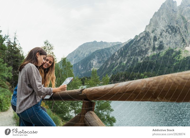 Women with map on mountain road Woman Street Mountain Walking Hiking Vacation & Travel Adventure Tourist Youth (Young adults) Nature Trip Leisure and hobbies