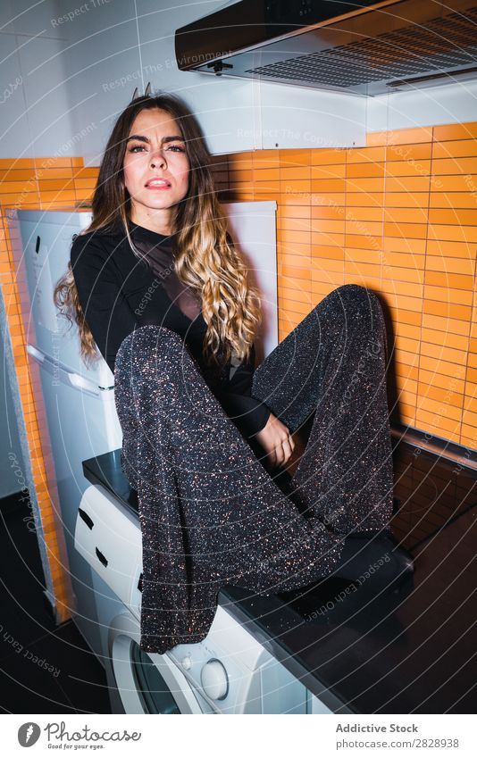 Woman sitting on kitchen table pretty Posture Home Sit Table Kitchen Looking into the camera Beautiful Lifestyle Youth (Young adults) Human being Happy