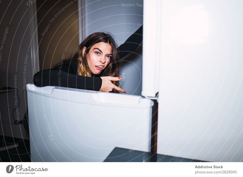 Disgusted woman at opened fridge Woman Indicate Looking into the camera Food Kitchen Youth (Young adults) surprised smelling terrified Unpleasant tainted