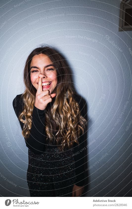 Expressive woman at wall Woman Human being unsure doubtful annoyed Ambiguous Youth (Young adults) pretty Irritation Cynical Portrait photograph Expression