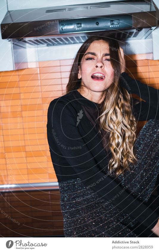 Woman sitting on kitchen table pretty Posture Home Sit Table Kitchen Looking into the camera Beautiful Lifestyle Youth (Young adults) Human being Happy