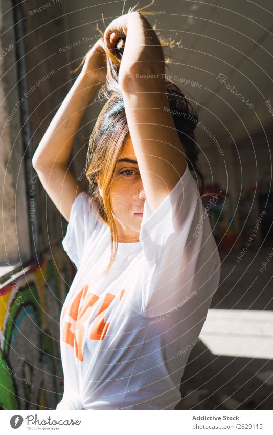 Smiling woman in abandoned room with graffiti Woman Cheerful Posture Looking into the camera Youth (Young adults) grungy Graffiti Multicoloured Room pretty