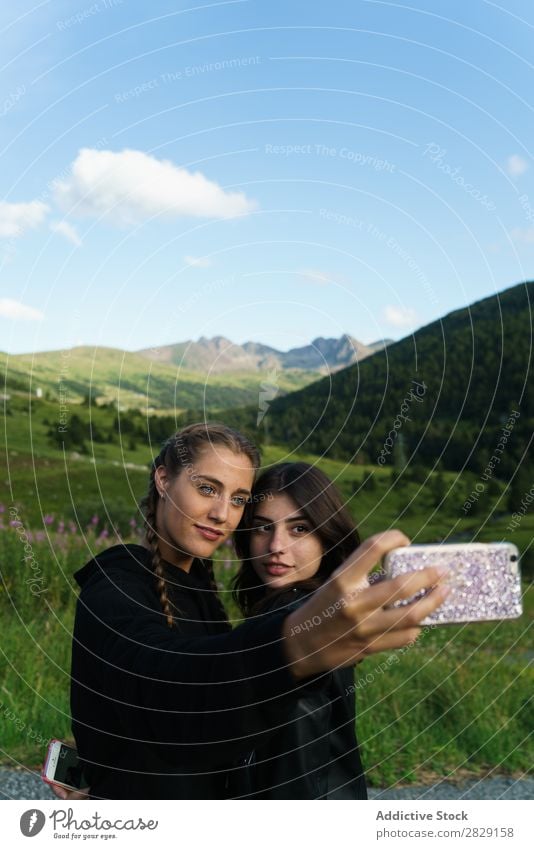 Women taking selfie on meadow Woman Selfie Meadow PDA Summer Youth (Young adults) Portrait photograph Grass Joy Mobile Nature Lifestyle pretty Posture Gadget