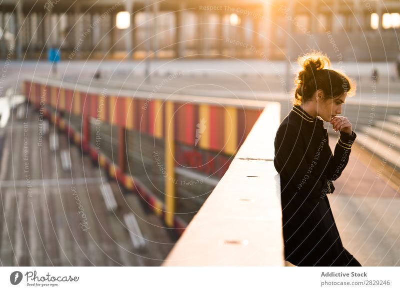 Pensive woman at the handrail Woman Considerate Chin Self-confident Easygoing Clothing Style Earnest Youth (Young adults) Hair Beautiful Girl Attractive glamour