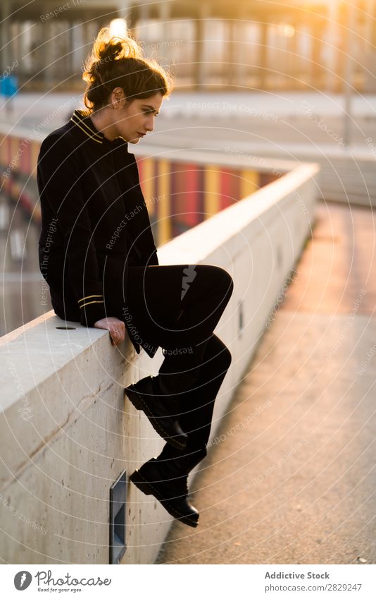 Pensive woman at the handrail thoughtful pensive chin confident casual clothes stylish serious young hair female beautiful girl attractive glamour cool lady