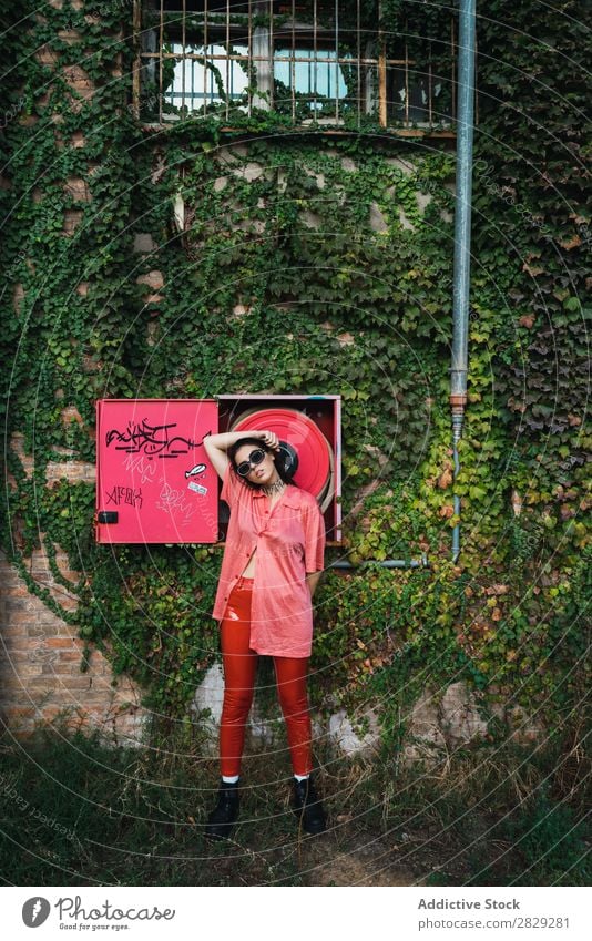 Woman posing at fire hose Style Street Town Fire-fighting tube Red Posture Plant Growth Sunglasses Portrait photograph Attractive Beauty Photography