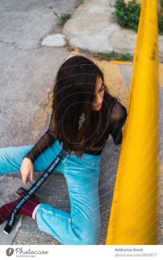 Woman sitting near fence Style Street Town Posture Sit Fence Asphalt Portrait photograph Attractive Beauty Photography Hip & trendy Lifestyle pretty Fashion