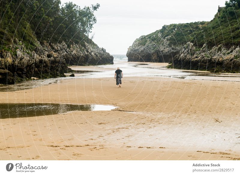 Person walking in sandy bay Human being Bay Beach Calm Summer Tropical Remote Vantage point Landscape Coast seascape Nature Sand Rock Promenade Tourism tranquil