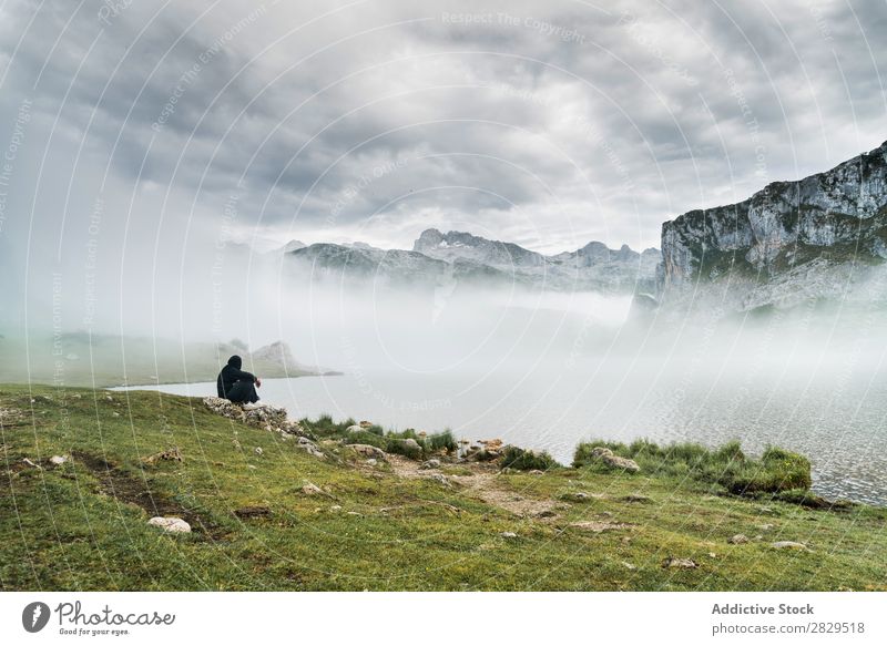 Anonymous person on lake in mountains Human being Mountain Lake Fog Mysterious Nature Landscape travelers Peaceful Natural Adventure Mystery Silhouette Lakeside