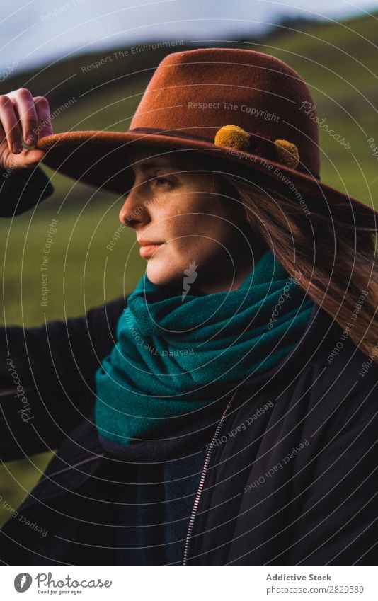 Dreamy woman standing at fence on field Woman Sit Field Green Nature Meadow Fence Stand Relaxation Rest Looking away Hat Spring Summer Grass Landscape