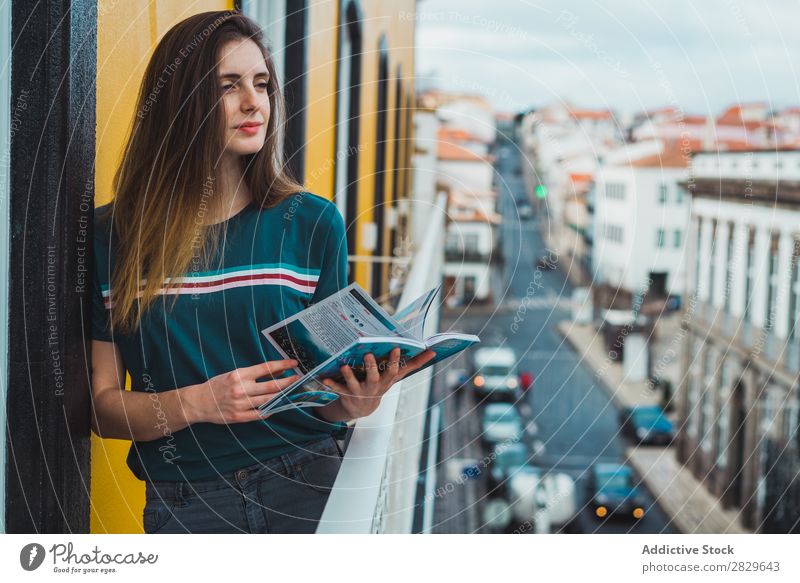 Charming brunette on balcony in cityscape Woman Balcony Dream Skyline Considerate romantic Pensive Vacation & Travel Beauty Photography Easygoing Think tender