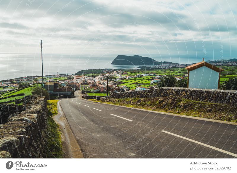 Roadway in remote area on shoreline Coast Village Street Ocean Landscape Tourism Nature Peaceful Vantage point Valley Bright Vacation & Travel Remote Rural