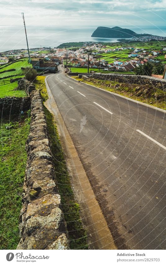 Roadway in remote area on shoreline Coast Village Street Ocean Landscape Tourism Nature Peaceful Vantage point Valley Bright Vacation & Travel Remote Rural