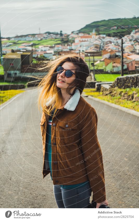 Young model on street in village Woman Town Vacation & Travel Style Street waving hair romantic Coast Portrait photograph Village Tourist coastal Joy Ocean