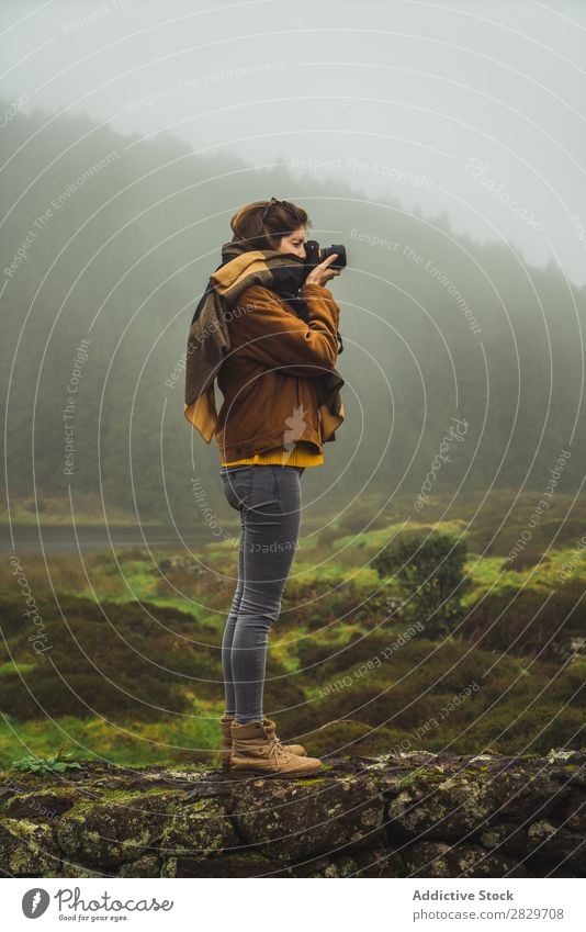 Woman taking photo in misty woods Fog Nature Photographer Vacation & Travel Landscape Vantage point Environment Capture Photography Adventure Camera traveler