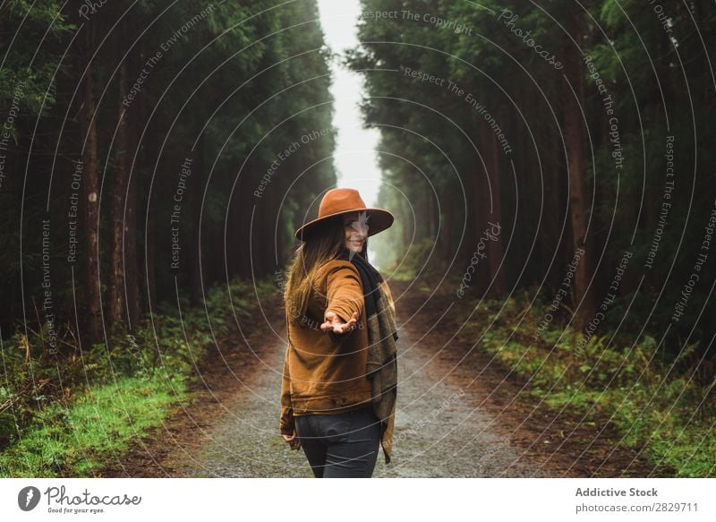 Woman making gestures in woods Forest follow me romantic Street enchanted Wilderness Lush Plant Cheerful leading Jacket Green Leisure and hobbies Happy