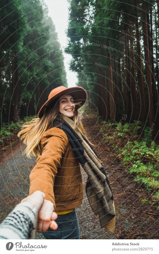 Woman holding hand of photographer in woods Forest follow me romantic Together holding hands Street enchanted Wilderness Lush Plant Cheerful leading Jacket