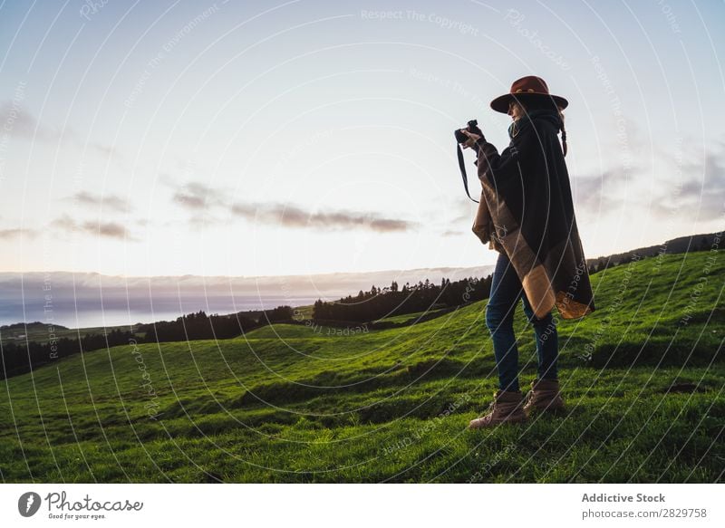 Woman in green cold fields Grassland Freedom Field Peaceful Nature Rural Wilderness scenery Stand Green Landscape Fog Dream Pasture Tourism tranquil Valley Cold