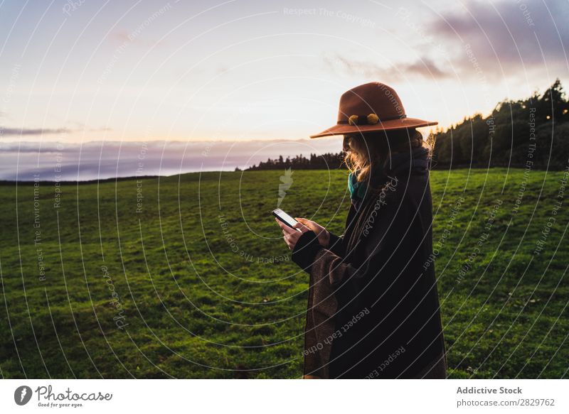 Woman in green cold fields Grassland Freedom Field Peaceful Nature Rural Wilderness scenery Stand Green Landscape Fog Dream Pasture Tourism tranquil Valley Cold