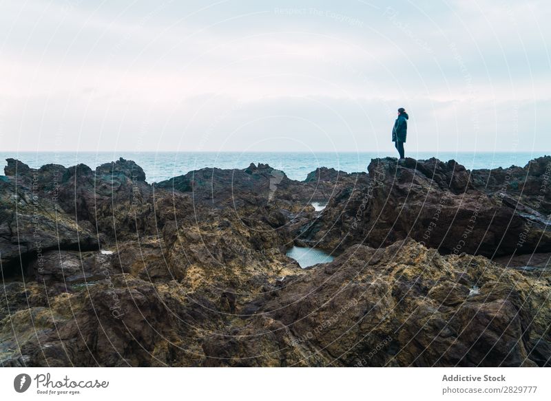 Woman standing on stone Nature seaside Rock Coast Beach Vacation & Travel Ocean Summer Tourist Tourism Landscape Youth (Young adults) Beautiful Lifestyle