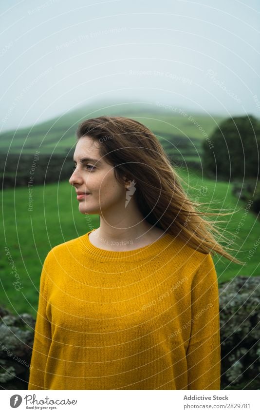 Smiling woman at green field Woman Field Green Vantage point Tourism Vacation & Travel Stand Nature Fence Landscape Stone Fog Grass Meadow Rural Clouds Seasons