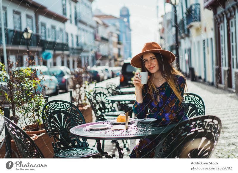 Smiling woman with cup in outside cafe Woman pretty Style Street Hat Coffee Cup Café Exterior shot Fashion Beautiful Youth (Young adults) Portrait photograph