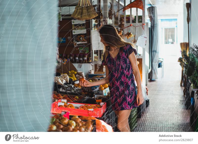 Woman buying fruits on market pretty Style Street Storage Markets picking choosing Fruit Exterior shot Fashion Beautiful Youth (Young adults)