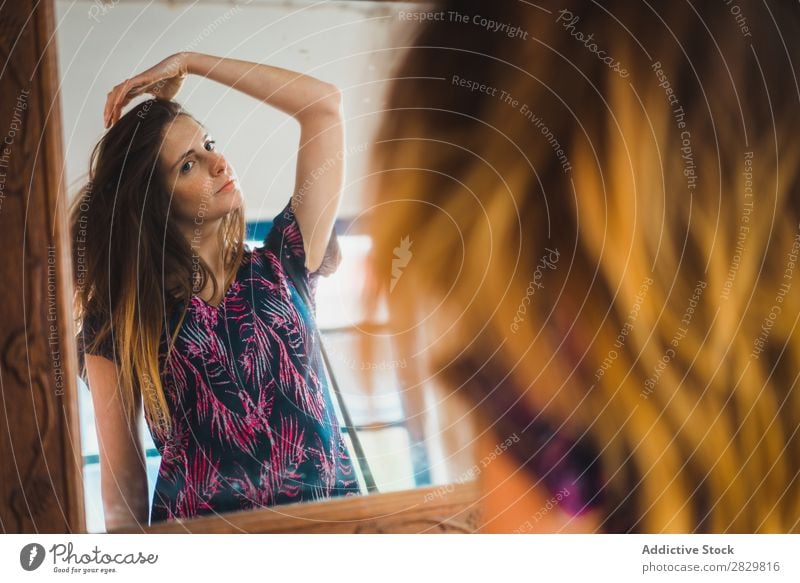 Woman adjusting hair at mirror Reflection pretty Mirror Adjust Hair Beautiful Youth (Young adults) Beauty Photography Portrait photograph Attractive Human being