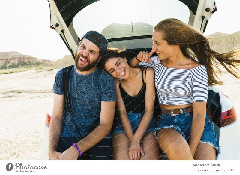 Friends sitting in car trunk Friendship Trunk Together Summer Human being Trip Joy Vacation & Travel Happy Adventure Lifestyle Youth (Young adults) Street