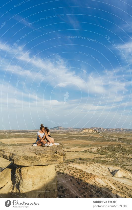 Excited women lying on cliff Woman Cliff Relaxation Vacation & Travel Adventure Rock Mountain Tourist Friendship Together Smiling Happy Excitement Freedom