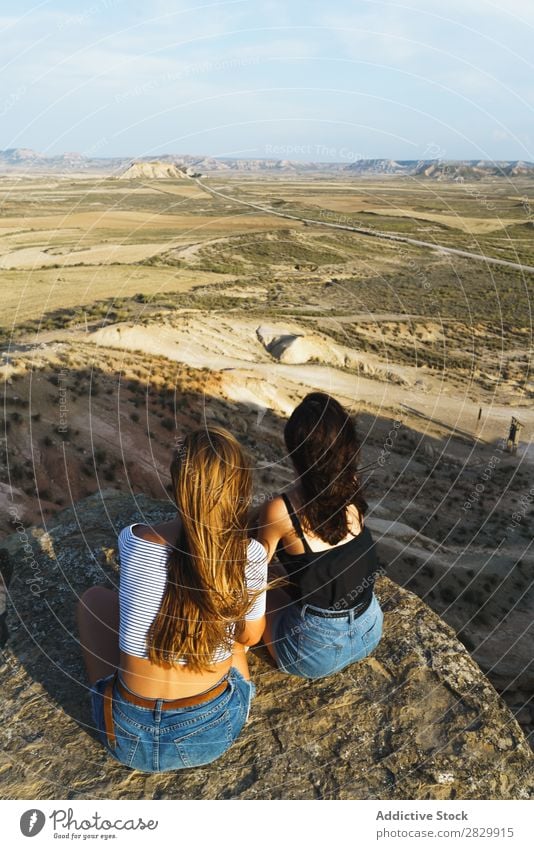 Excited women lying on cliff Woman Cliff Relaxation Vacation & Travel Adventure Rock Mountain Tourist Friendship Together Smiling Happy Excitement Freedom