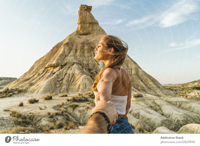 Woman holding hand of photographer at cliff Cliff follow me holding hands Gesture Photographer To enjoy pretty Youth (Young adults) Posture Beautiful Girl