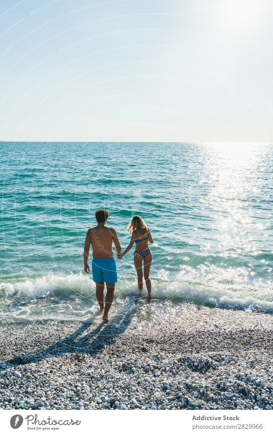 Couple posing in ocean water Ocean Swimming Summer Exotic romantic Water Love Tropical Beauty Photography enjoyment Sun Vacation & Travel Honeymoon Paradise