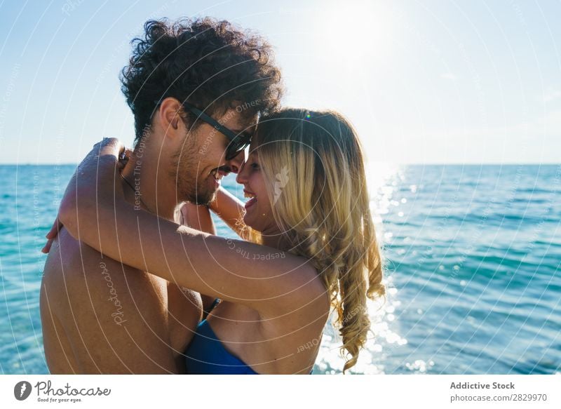 Loving couple posing on beach Couple Beach Love Honeymoon Summer Paradise Exotic romantic Ocean Embrace Tropical Beauty Photography enjoyment Sun