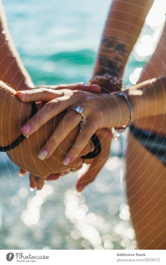 Crop couple in swimsuit holding hands Couple Ocean Honeymoon Happiness Posture Love Freedom Traveling Summer Hand Relaxation Leisure and hobbies 2 Together