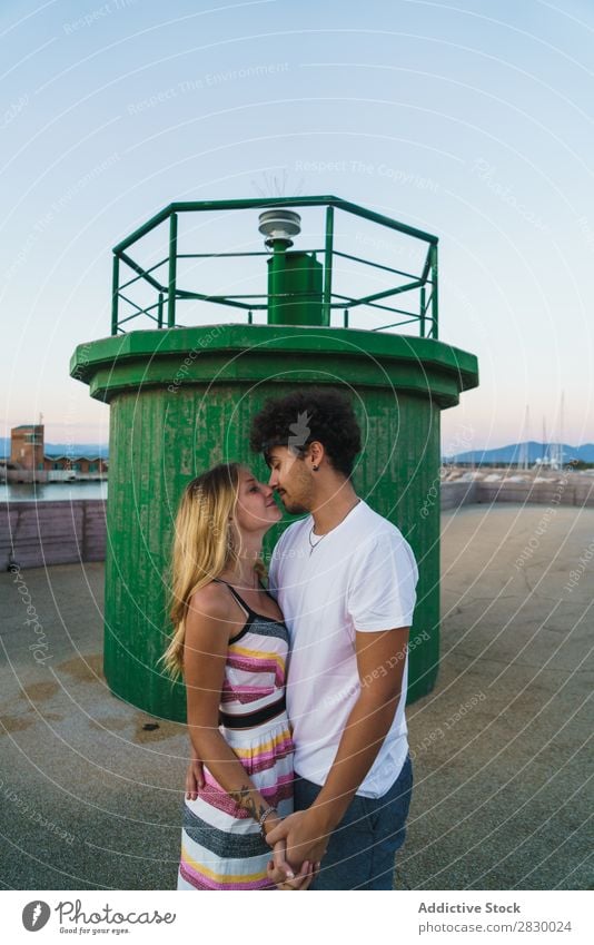 Loving couple posing in dock Couple romantic loving Kissing Posture Honeymoon Coast Romance Together Youth (Young adults) embracing Relaxation Traveling