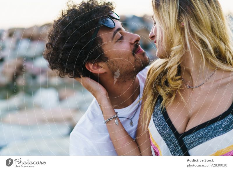 Embracing people posing on rocks Couple Coast Posture embracing Dream romantic Happiness Landscape loving Honeymoon Nature Romance Together Meditative