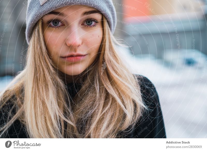 Pretty woman posing in winter town Woman Style Street Snow Looking into the camera fashionable To enjoy Youth (Young adults) pretty Winter Cold Cool (slang)