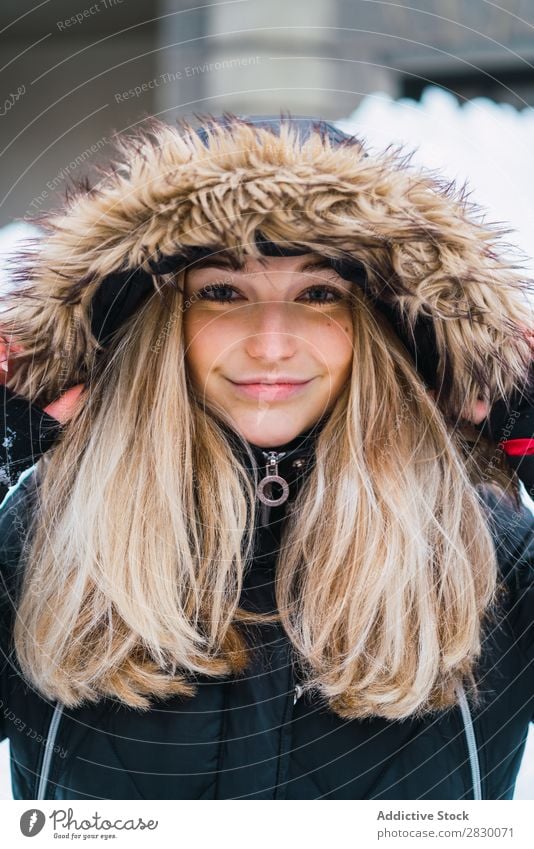 Pretty woman posing in winter town Woman Style Street Snow Looking into the camera fashionable To enjoy Youth (Young adults) pretty Winter Cold Cool (slang)